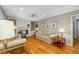 Cozy living room features a brick fireplace, built-in shelving, and hardwood flooring at 4774 Olde Village Ln, Atlanta, GA 30338