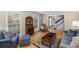 Cozy living room featuring hardwood floors, comfortable seating, and natural lighting at 4774 Olde Village Ln, Atlanta, GA 30338