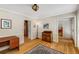 Additional room featuring hardwood floors, a small desk, and a large window at 4774 Olde Village Ln, Atlanta, GA 30338