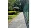 Paved pathway leading to a shaded gazebo adjacent to the tennis court in the neighborhood at 4774 Olde Village Ln, Atlanta, GA 30338