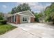 Charming home with attached garage featuring a spacious driveway and manicured lawn at 599 Honey Creek Rd, Conyers, GA 30094