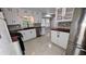 Modern kitchen with butcher block countertops, white cabinets, and stainless steel appliances at 599 Honey Creek Rd, Conyers, GA 30094