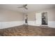 Large living room featuring hardwood floors, neutral paint, and an open layout at 599 Honey Creek Rd, Conyers, GA 30094
