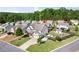 Aerial view of a beautiful home with a spacious yard, play area, and lush green surroundings at 6235 Crescent Landing Dr, Cumming, GA 30028