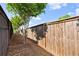 Fenced backyard offering privacy, shade, and plenty of room at 6235 Crescent Landing Dr, Cumming, GA 30028