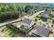 Aerial view of a home with a spacious fenced backyard including a playset, shed, and patio with a fire pit at 6235 Crescent Landing Dr, Cumming, GA 30028
