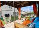 Inviting backyard lounge with a covered pergola, comfortable seating, and charming string lights at 6235 Crescent Landing Dr, Cumming, GA 30028
