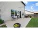 Outdoor patio with string lights, dining set, and comfortable seating, ideal for relaxing and entertaining at 6235 Crescent Landing Dr, Cumming, GA 30028