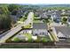 Aerial view of the home's backyard with a large, fenced lawn, a play area, a garden, and a covered patio at 6235 Crescent Landing Dr, Cumming, GA 30028