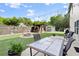Expansive backyard with a fire pit, dining area, pergola, and lush green lawn, perfect for outdoor activities at 6235 Crescent Landing Dr, Cumming, GA 30028