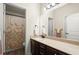 Clean secondary bathroom with a granite countertop, wood cabinets, and tub/shower combo at 6235 Crescent Landing Dr, Cumming, GA 30028