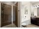 Bright bathroom featuring a tiled walk-in shower, soaking tub, and wood-look vinyl plank flooring at 6235 Crescent Landing Dr, Cumming, GA 30028