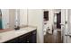 Granite countertop and dark cabinets in this bathroom provide a clean and functional space at 6235 Crescent Landing Dr, Cumming, GA 30028