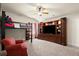 Bedroom with loft bed, ceiling fan and built-in shelving with TV and chair at 6235 Crescent Landing Dr, Cumming, GA 30028