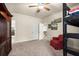 Spacious bedroom featuring a cozy red chair and bunk beds at 6235 Crescent Landing Dr, Cumming, GA 30028