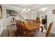 Traditional dining room featuring a wooden table set for ten and elegant chandelier lighting at 6235 Crescent Landing Dr, Cumming, GA 30028