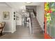 View of the foyer with staircase and decor including a decorative wreath on the front door at 6235 Crescent Landing Dr, Cumming, GA 30028