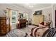 Cozy living room features natural light, a piano, and elegant decor at 6235 Crescent Landing Dr, Cumming, GA 30028