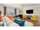 Bright living room boasts a fireplace, two armchairs, and a comfortable sectional with a large window at 6235 Crescent Landing Dr, Cumming, GA 30028