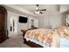 Spacious main bedroom with ceiling fan, and access to the bathroom and closet at 6235 Crescent Landing Dr, Cumming, GA 30028