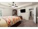 The main bedroom offers a ceiling fan, plush carpet, and a neutral color scheme at 6235 Crescent Landing Dr, Cumming, GA 30028