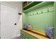 Bright mudroom features custom storage, built-in bench, and plenty of hooks at 6235 Crescent Landing Dr, Cumming, GA 30028