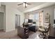Office space with vaulted ceiling, floral curtains, and a large desk ideal for a functional workspace at 6235 Crescent Landing Dr, Cumming, GA 30028