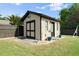 Outdoor shed featuring a charming design, complemented by a neatly kept yard at 6235 Crescent Landing Dr, Cumming, GA 30028