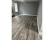 Neutral living room featuring gray walls, recessed lights, and wide plank wood-look flooring at 324 Cynthia Ct, Jonesboro, GA 30238