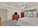 Bedroom featuring a tray ceiling, ceiling fan, and a large window offering natural light at 4373 Mikandy Nw Dr, Kennesaw, GA 30144