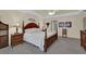An expansive bedroom with a four-poster bed, carpeted floors, and ample natural light at 4373 Mikandy Nw Dr, Kennesaw, GA 30144