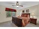 Bedroom showcasing a ceiling fan and window with natural light at 4373 Mikandy Nw Dr, Kennesaw, GA 30144