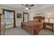 Bedroom featuring a window with decorative curtains and carpeted floors at 4373 Mikandy Nw Dr, Kennesaw, GA 30144