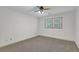 Bedroom featuring carpeted floors, ceiling fan, and window with natural light at 4373 Mikandy Nw Dr, Kennesaw, GA 30144