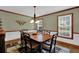 Traditional dining room features hardwood floors, trim and modern light fixture at 4373 Mikandy Nw Dr, Kennesaw, GA 30144