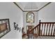 Grand foyer with large window, tray ceiling, hardwood floors, and wrought iron railing at 4373 Mikandy Nw Dr, Kennesaw, GA 30144