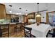 Eat-in kitchen with hardwood floors, wood cabinets, and stainless appliances at 4373 Mikandy Nw Dr, Kennesaw, GA 30144