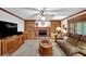 Inviting living space with a fireplace, built-in bookcases, and comfortable seating arrangement at 4373 Mikandy Nw Dr, Kennesaw, GA 30144
