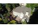 Aerial view of home showcasing outdoor patio, lush landscaping, and surrounding trees, perfect for outdoor living at 5004 Lake Mist Se Dr, Mableton, GA 30126