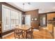 Cozy dining room featuring hardwood floors, pendant lighting, and views into the kitchen at 5004 Lake Mist Se Dr, Mableton, GA 30126