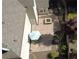 Aerial view of a backyard patio featuring a built-in fire pit and outdoor dining area at 5004 Lake Mist Se Dr, Mableton, GA 30126