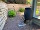 Rain barrel, mulch and retaining wall creating a sustainable and inviting backyard space at 5004 Lake Mist Se Dr, Smyrna, GA 30126
