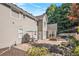 Backyard view of a home featuring a brick patio, fire pit, and well-maintained landscaping at 5004 Lake Mist Se Dr, Smyrna, GA 30126