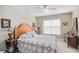 A comfortable bedroom with neutral walls, hardwood floors, a window and classic furniture at 5004 Lake Mist Se Dr, Smyrna, GA 30126