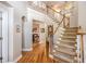 Grand foyer featuring a staircase, hardwood floors, and an open view to the living area at 5004 Lake Mist Se Dr, Smyrna, GA 30126