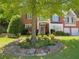 Charming two-story brick home with landscaped front yard and a welcoming entrance at 5004 Lake Mist Se Dr, Smyrna, GA 30126