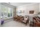 An office space featuring a large window, a piano, and a small table with chairs at 5004 Lake Mist Se Dr, Smyrna, GA 30126