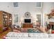 Inviting living room with fireplace, built-in bookshelves, and large windows for natural light at 5004 Lake Mist Se Dr, Smyrna, GA 30126