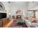 Spacious living room featuring a fireplace, hardwood floors, and comfortable seating at 5004 Lake Mist Se Dr, Smyrna, GA 30126