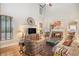 Bright living room features high ceilings, fireplace, wood floors, and lots of natural light at 5004 Lake Mist Se Dr, Smyrna, GA 30126
